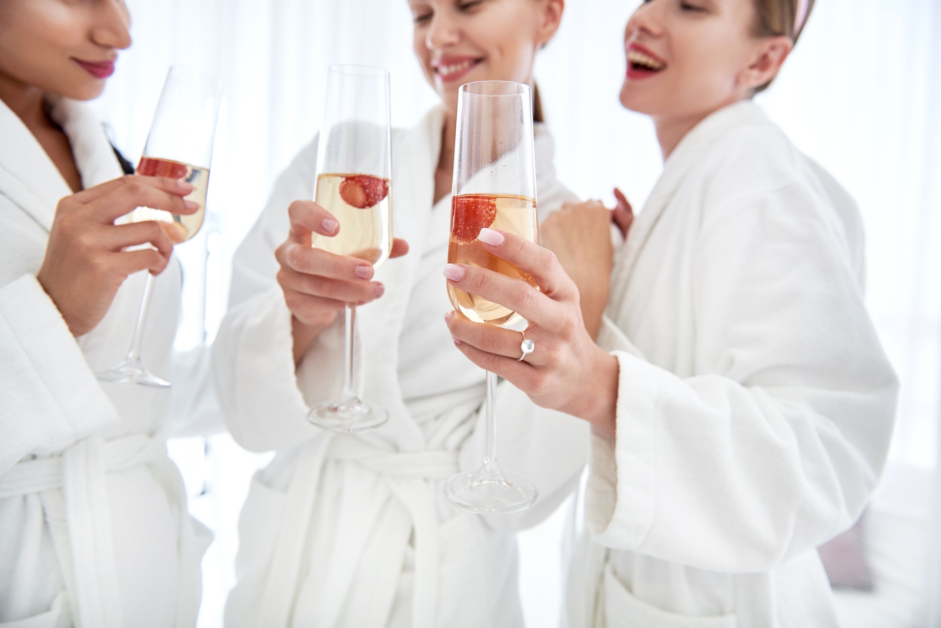 Glasses of champagne in ladies hands drink