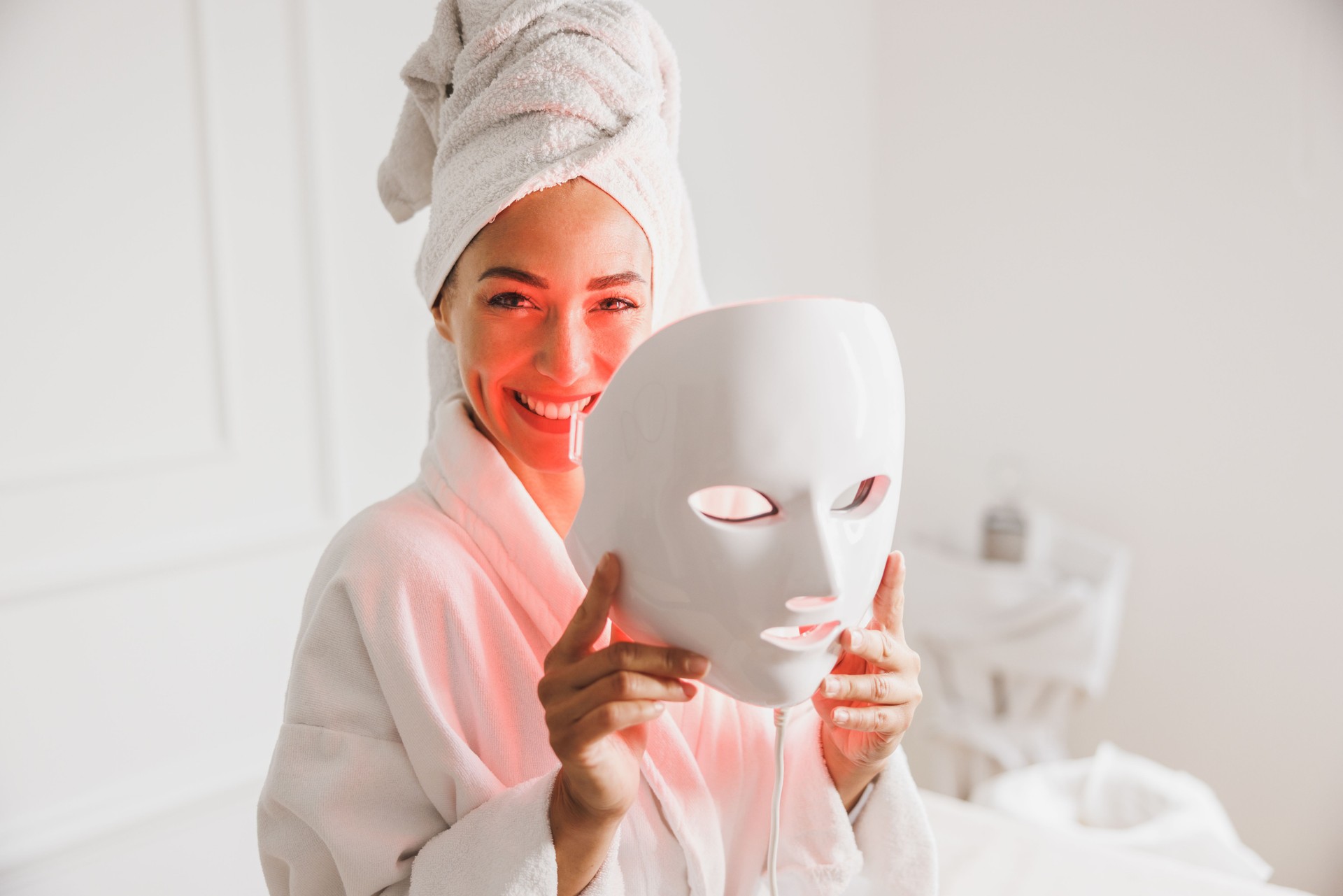 Woman Getting A Led Light Facial Mask Treatment At The Beauty Salon